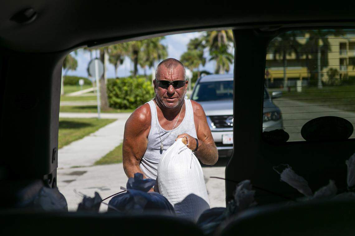 Danny Marcello, from Fort Pierce, loads bags of sand in preparation for Hurricane Dorian at Jaycee Park on Hutchinson Island on Friday, August 30, 2019.
