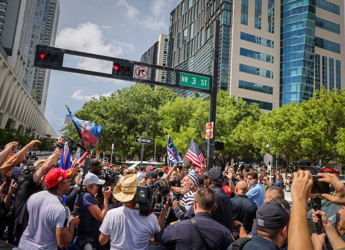 Domenic Santana is arrested after obstructing the Donald Trump’s motorcade after the former president left the Wilkie D. Ferguson Jr. U.S. Courthouse on Tuesday, June 13, 2023, in downtown Miami, Fla. Former President Donald Trump plead innocent to the total of 37 counts in a federal indictment related to his handling of classified documents after he left office. He is the first former president to face federal charges and is expected to arrive at Wilkie D. Ferguson, Jr. U.S. Courthouse on Tuesday, June 13, 2023. Note: The police was keeping people at bay away from Domenic Santana,