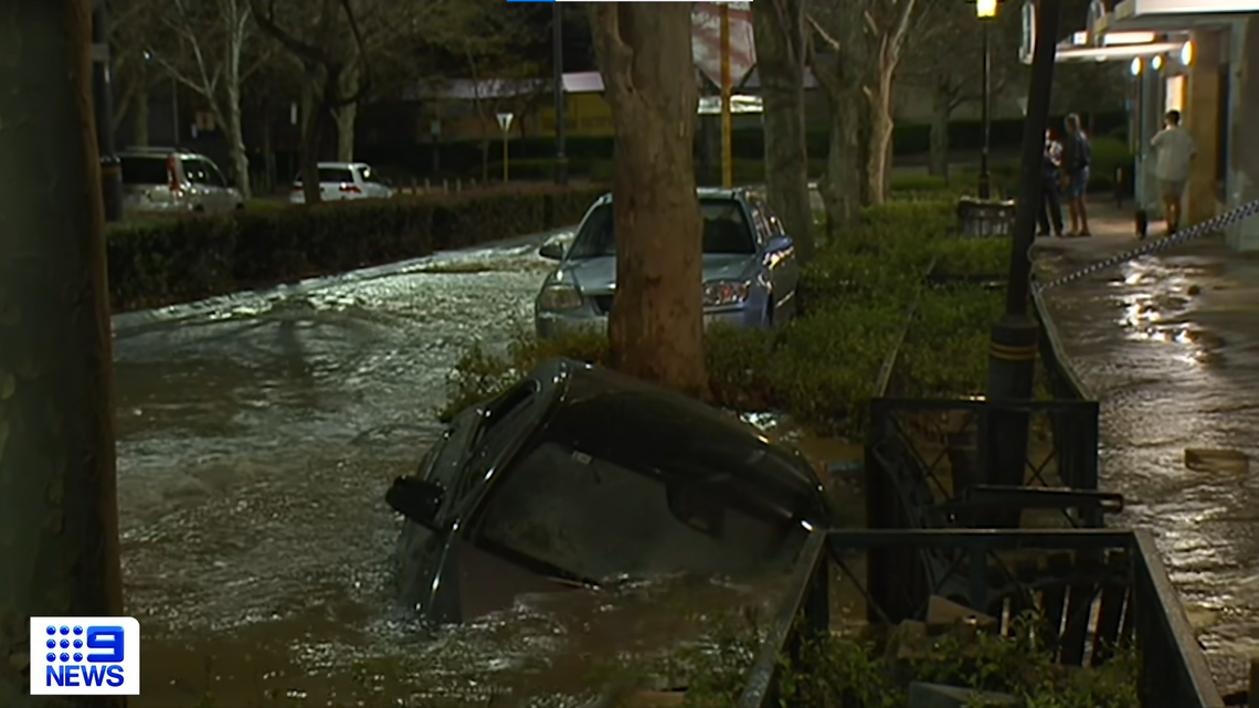 A water main burst in the Subiaco suburb outside of Perth, Australia, creating a sinkhole that flooded and swallowed an entire Mercedes-Benz, video shows.