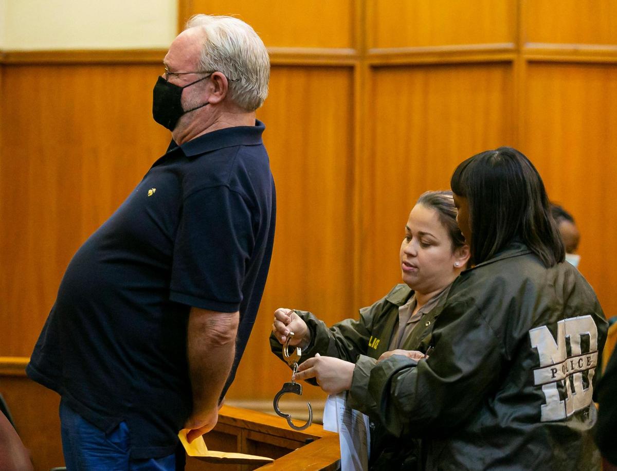 Tom Privett is handcuffed during his sentencing hearing at the Richard E. Gerstein Justice Building in Miami on Wednesday, November 17, 2021. Privett, a retired South Dade government teacher, pleaded guilty to raping an underaged student.
