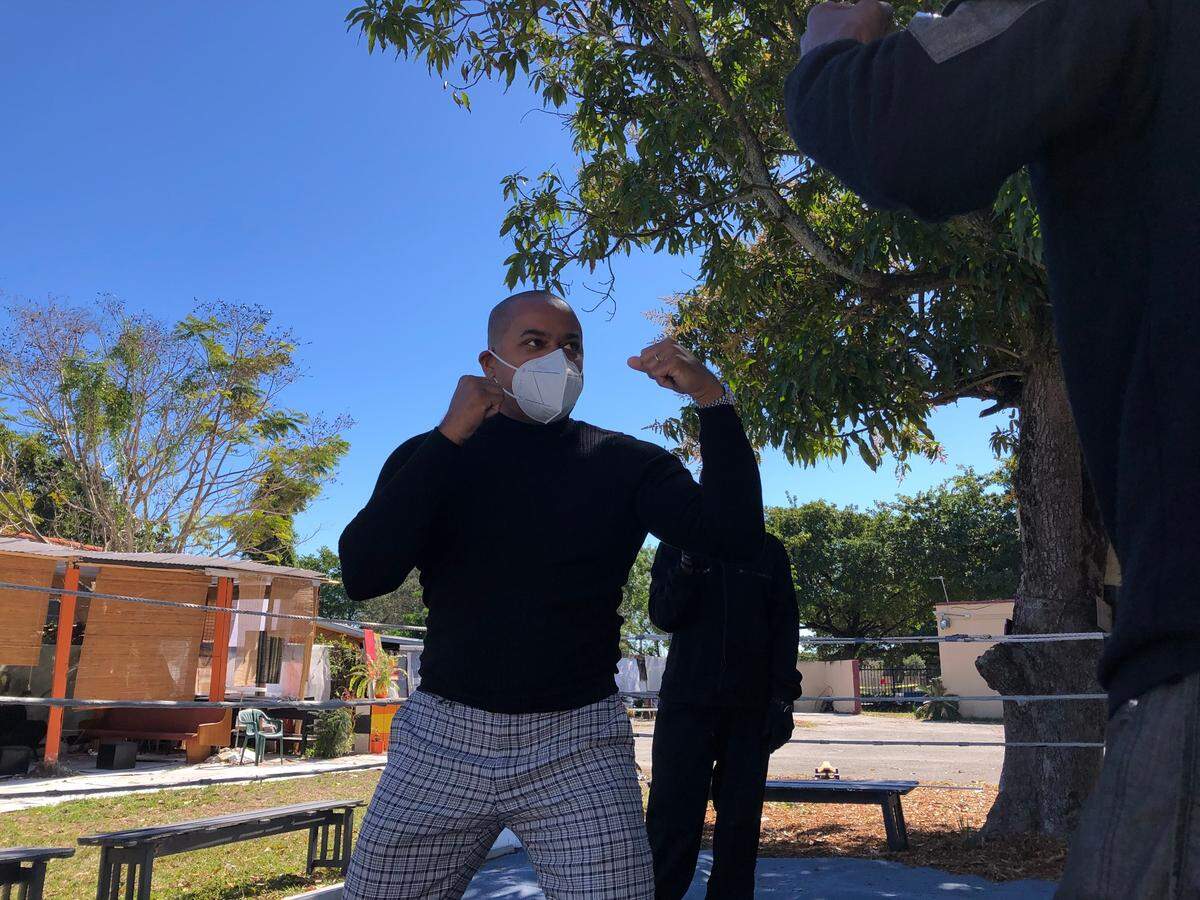 Miami-Dade Commissioner Keon Hardemon during a 2021 visit to Liberty City’s Broadway Arts District, where he tried out a backyard boxing ring set up for after-school activities.