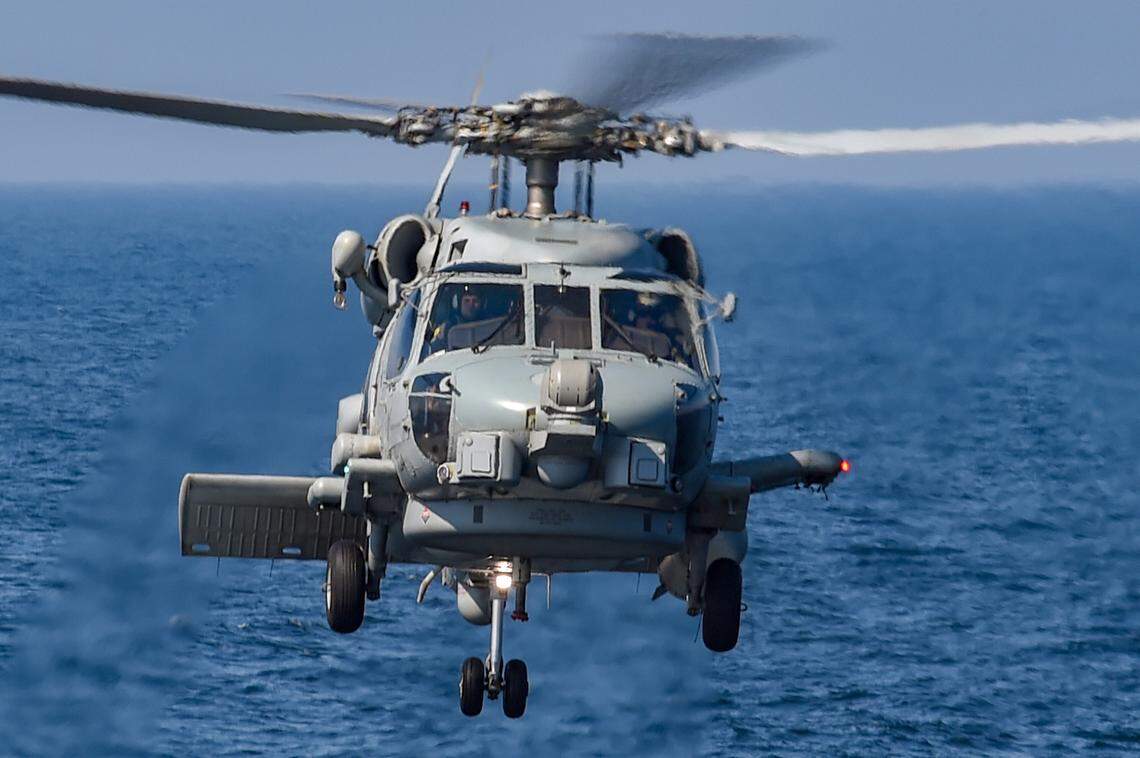 An MH-60R Seahawk helicopter approaches the flight deck of the guided-missile destroyer USS Gravely on the Balktic Sea in April 2019.
