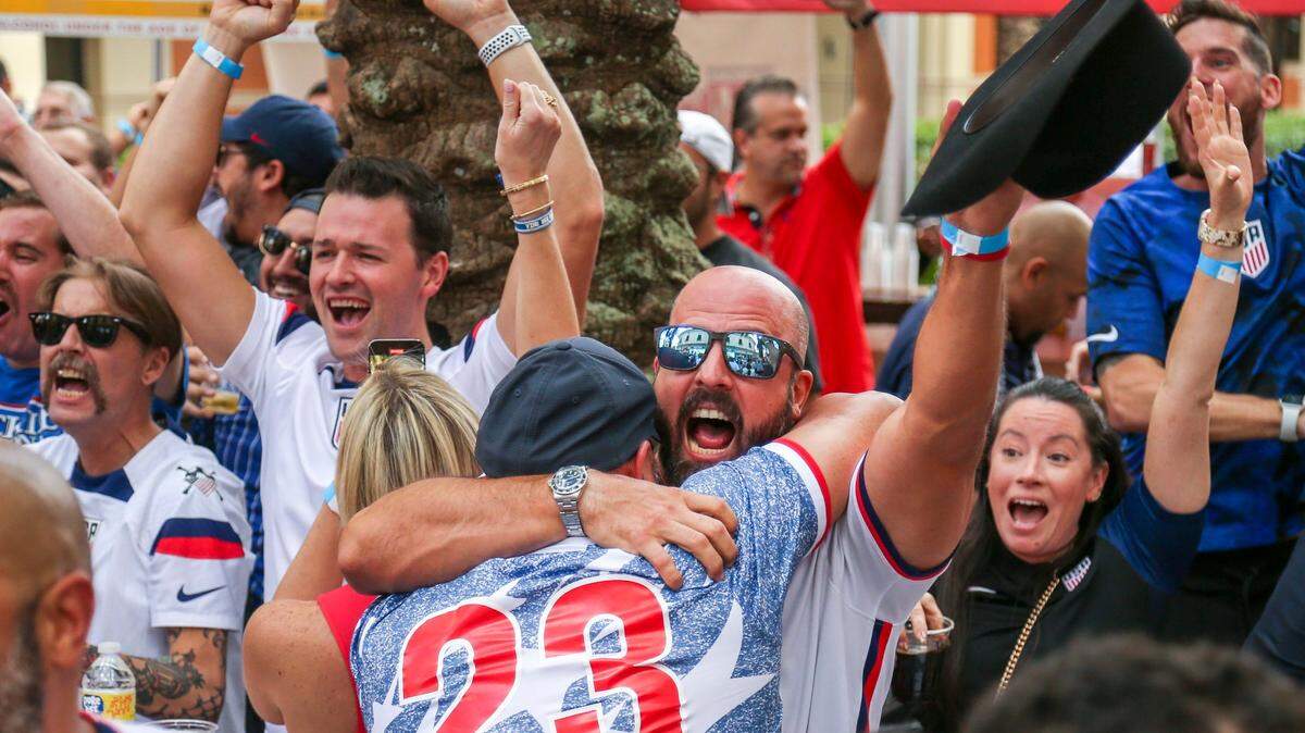 Soccer fans react as the United States scores a goal against Iran during a World Cup watch party at Fritz & Franz Bierhaus in Coral Gables, Florida, on Tuesday, November 29, 2022.