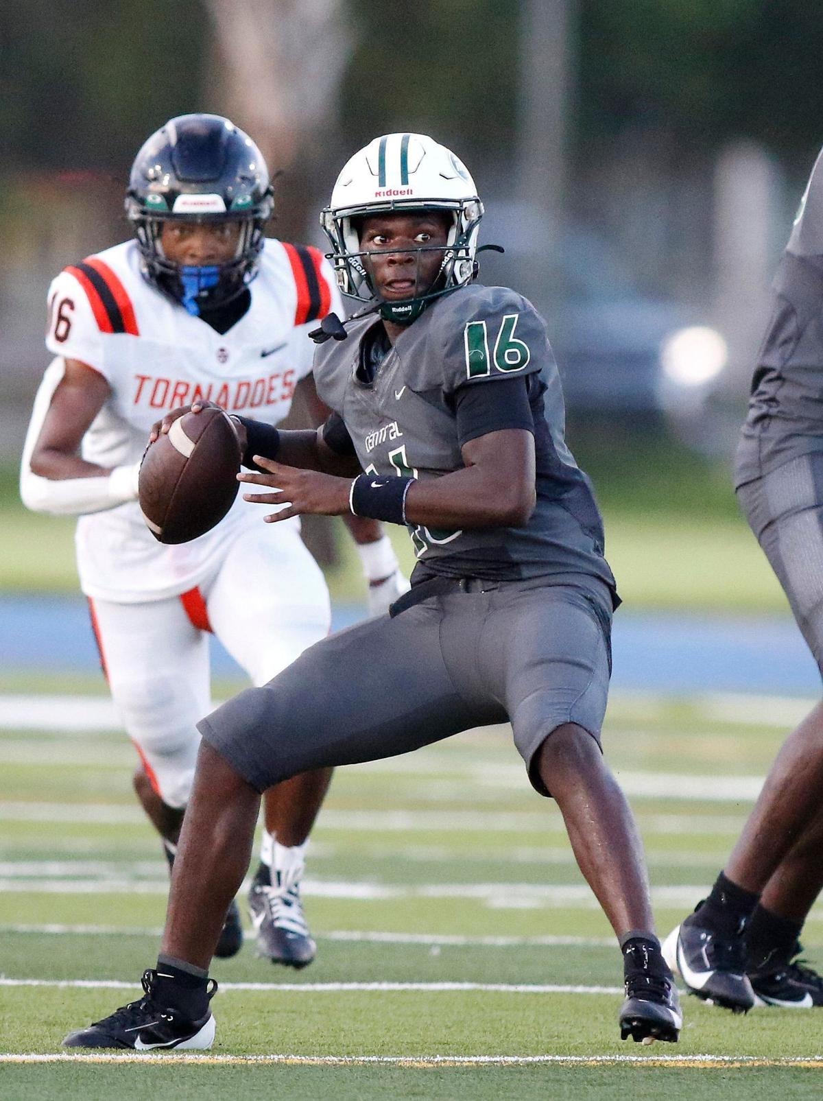 Miami Central Rockets quarterback Anthony McQueen (16) looks to pass against Booker T. Washington Tornadoes during football game on Saturday, September 7, 2024 at Traz Powell Stadium in Miami.