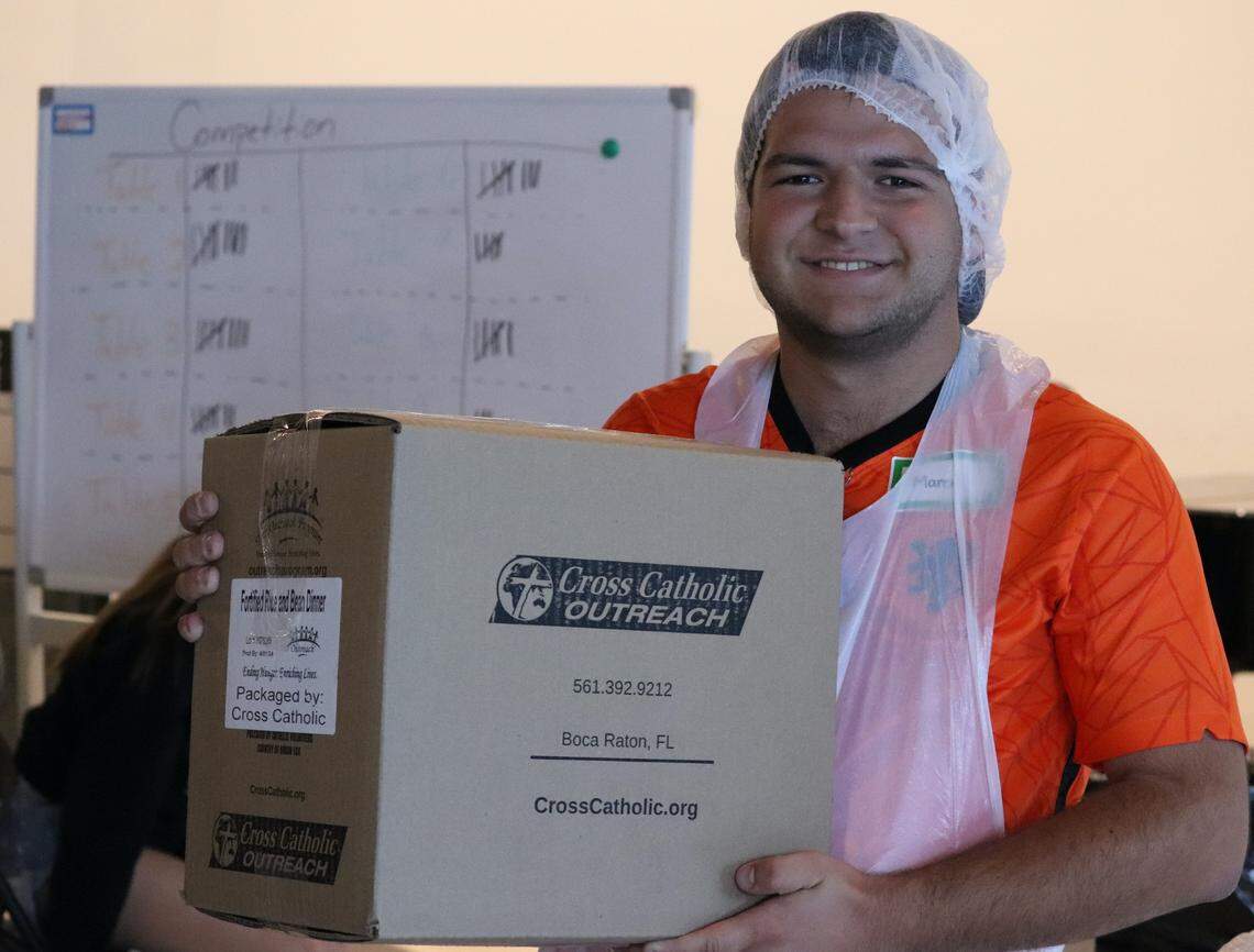 Marcel van Hemert, the vice president of UCatholic, UM’s Catholic ministry, and his group packed 11 boxes of food, two more than what each group was expected to complete during the first session of the food packaging event at St. Augustine Church in Coral Gables. The event surpassed its goal of 40,000 meals.