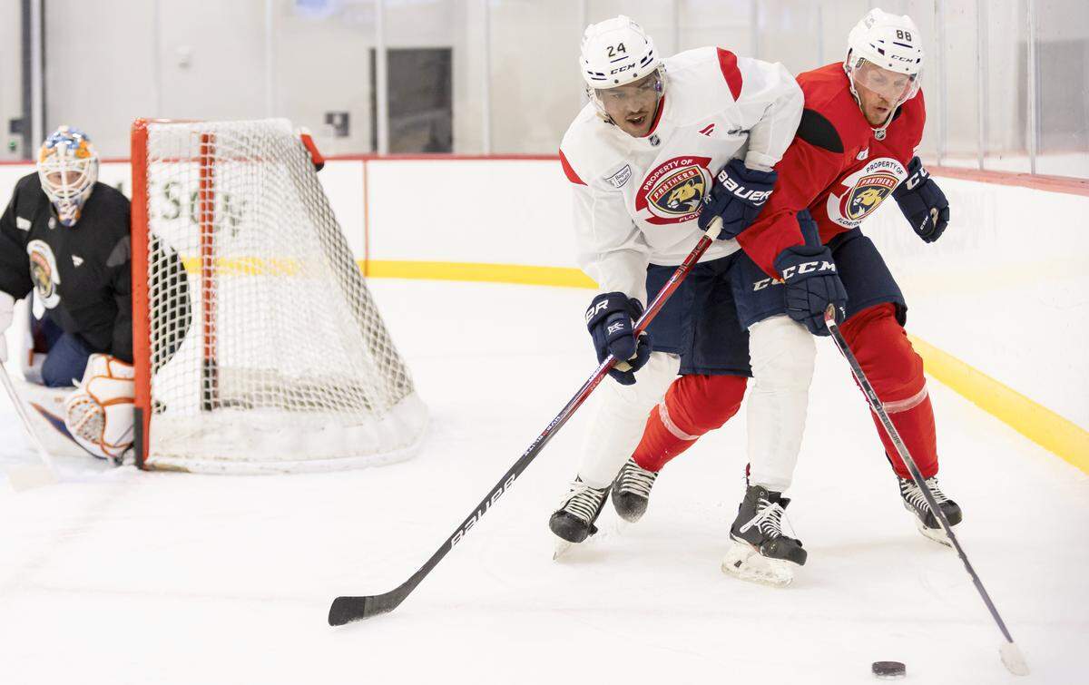 Florida Panthers right wing Justin Sourdif (24) and defenseman Nate Schmidt (88) run drills during training camp at the Baptist Health IcePlex on Thursday, Sept. 19, 2024, in Fort Lauderdale, Fla.
