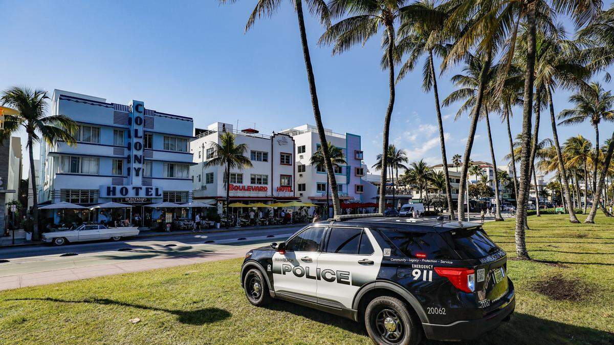 Miami Beach police increased enforcement of a city ordinance banning public camping in mid-2024, heeding the requests of elected officials. The number of camping arrests more than tripled in 2025. Here, a Miami Beach patrol car is parked as officers overlook Ocean Drive in the neighborhood of South Beach on Miami Beach, Florida, on Tuesday, March 24, 2026.