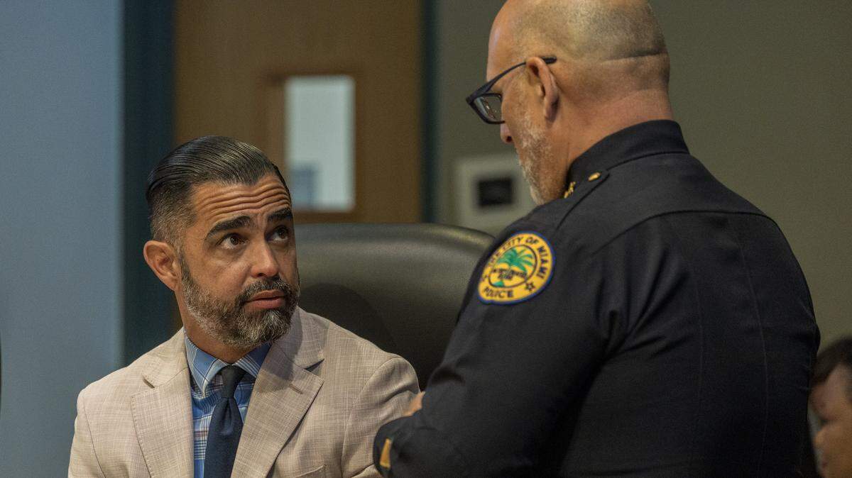 City of Miami Manager James Reyes talks with Chief Manuel "Manny" Morales, during a Miami City Commission meeting, at City Hall, on Thursday May 28, 2026.