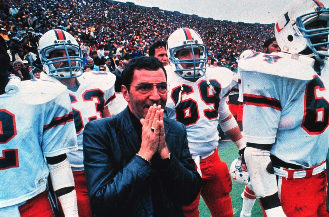 In 1999, UM'S chaplain prays on the sideline during a loss to Notre Dame.