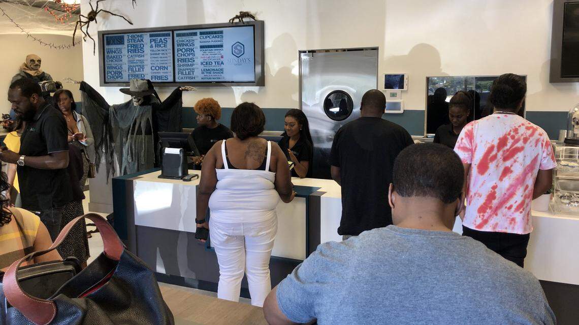The inside of Trick Daddy’s Sunday’s Eatery is full of hungry lunchtime diners.