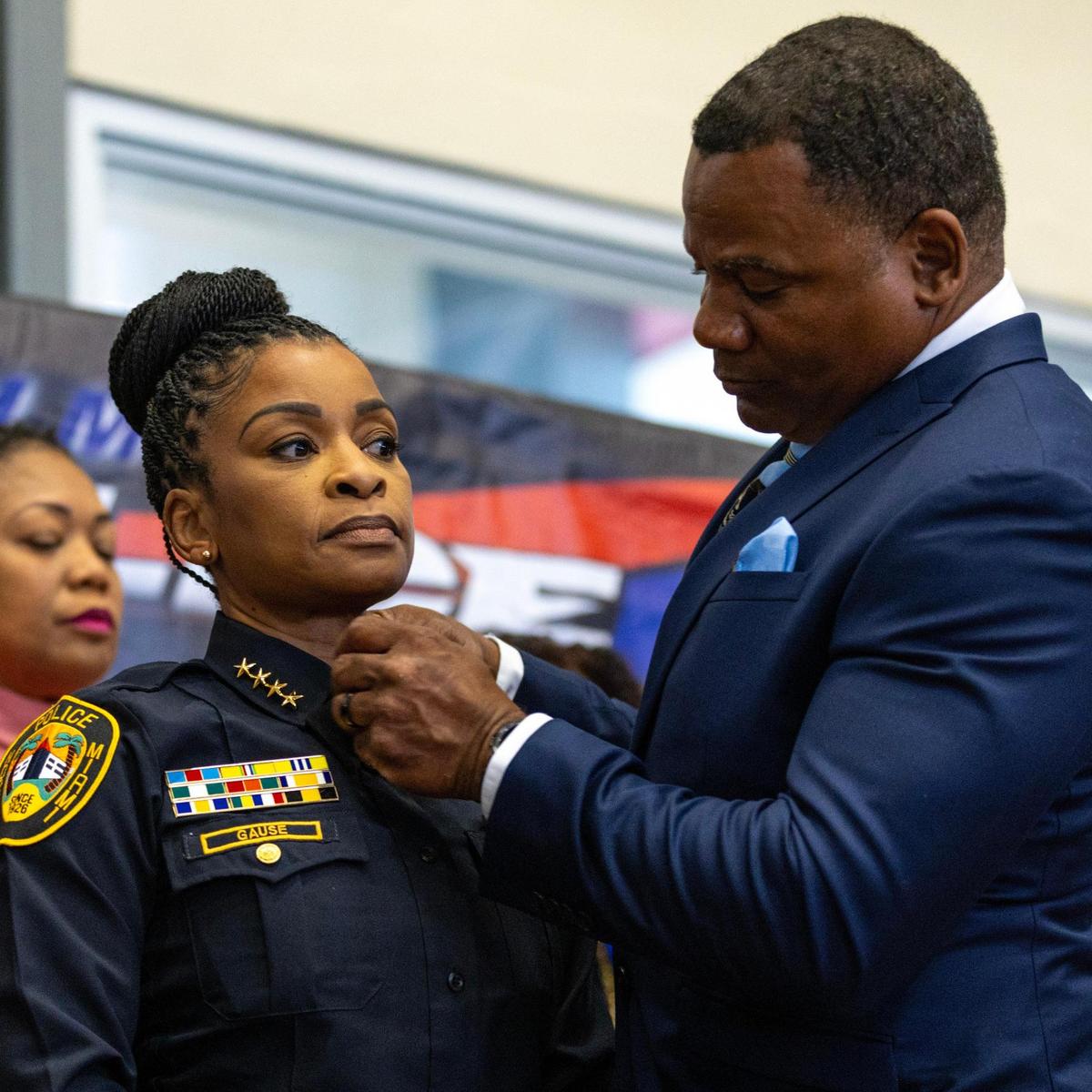 Newly appointed North Miami Police Chief Cherise G. Gause is pinned by her husband Anthony Gause, a Lieutenant with the Miami-Dade Fire Department, during a ceremony at Joe Celestin Center North Miami, Florida, on Friday, August 18, 2023.