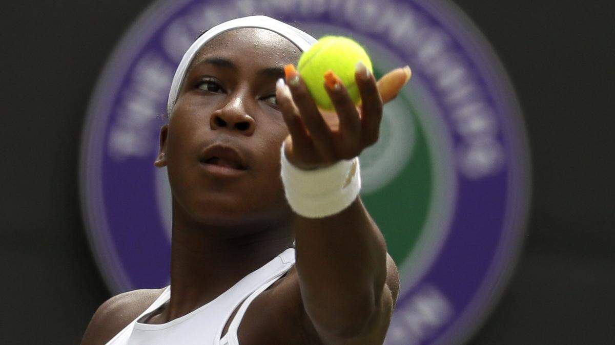 United States’ Cori “Coco” Gauff serves to Romania’s Simona Halep in a women’s singles match during day seven of the Wimbledon Tennis Championships in London, Monday, July 8, 2019.