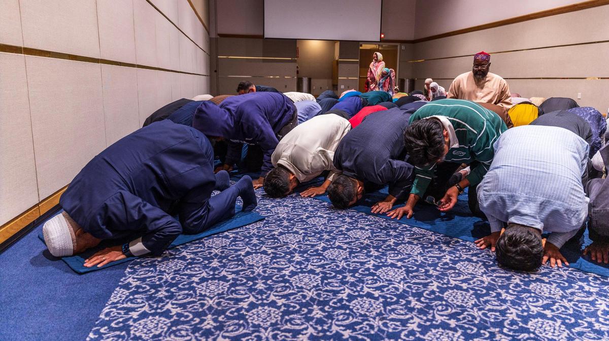 Iman Dr. Abdul Hamid Samra, far left, leads Maghrib prayer, during the Florida International University Jaffer Center for Muslim World Studies’ Annual Interfaith Iftar Dinner 2025 in observance of Ramadan.
