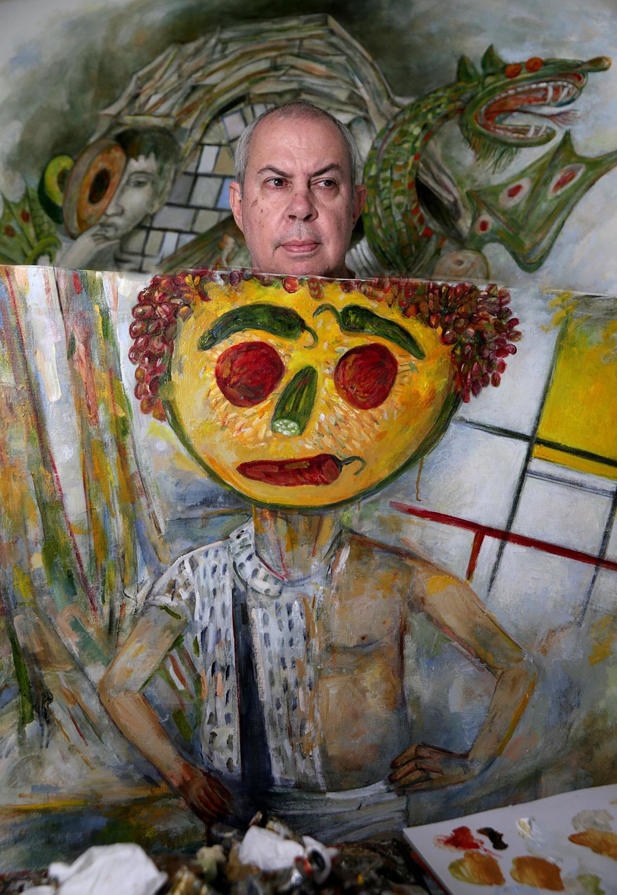 Cuban master artist Arturo Rodriguez with the piece Arcimboldo, Arbus, Mondrian, Cezanne, Henry Cartier Breson Ghost, Oil on Canvas 55X52, part of his show “Arcimboldo’s Ghost” at LnS Gallery in Miami on Dec. 8.