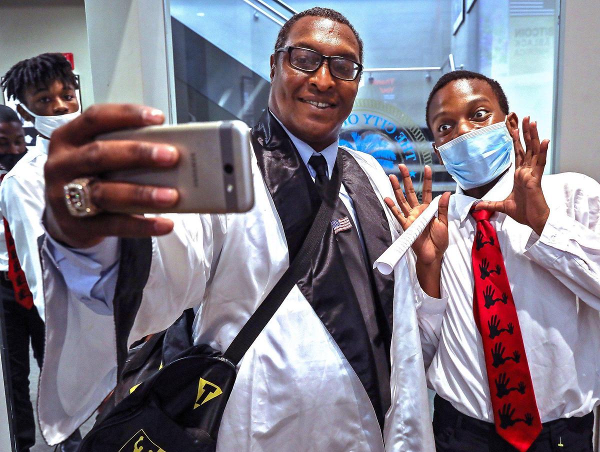 The eyes of Turner Tech Senior Jason Melus, 18, right, widen with excitement after requesting a selfie with Muhammad Ali Jr., left. The 5000 Role Models of Innovation Tour students gathered in Miami City Hall to learn about investing in cryptocurrency and become a part of the growing tech industry in Miami on Wednesday, Oct. 27, 2021.