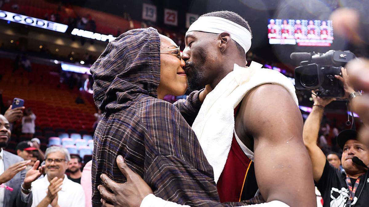WNBA player A'ja Wilson and Bam Adebayo #13 of the Miami Heat embrace after a 150-129 win over the Washington Wizards at Kaseya Center on March 10, 2026 in Miami.