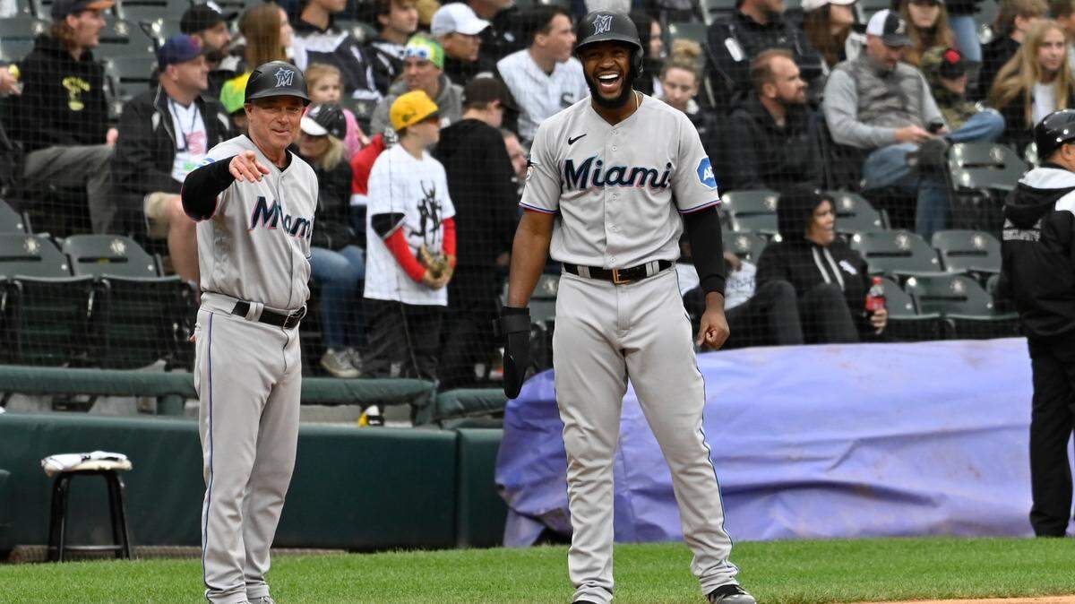 Jun 11, 2023; Chicago, Illinois, USA; Miami Marlins left fielder Bryan De La Cruz (14) yells with Miami Marlins third base/infield coach Jody Reed (33) after hitting a two RBI double against the Chicago White Sox during the ninth inning at Guaranteed Rate Field. Mandatory Credit: Matt Marton-USA TODAY Sports