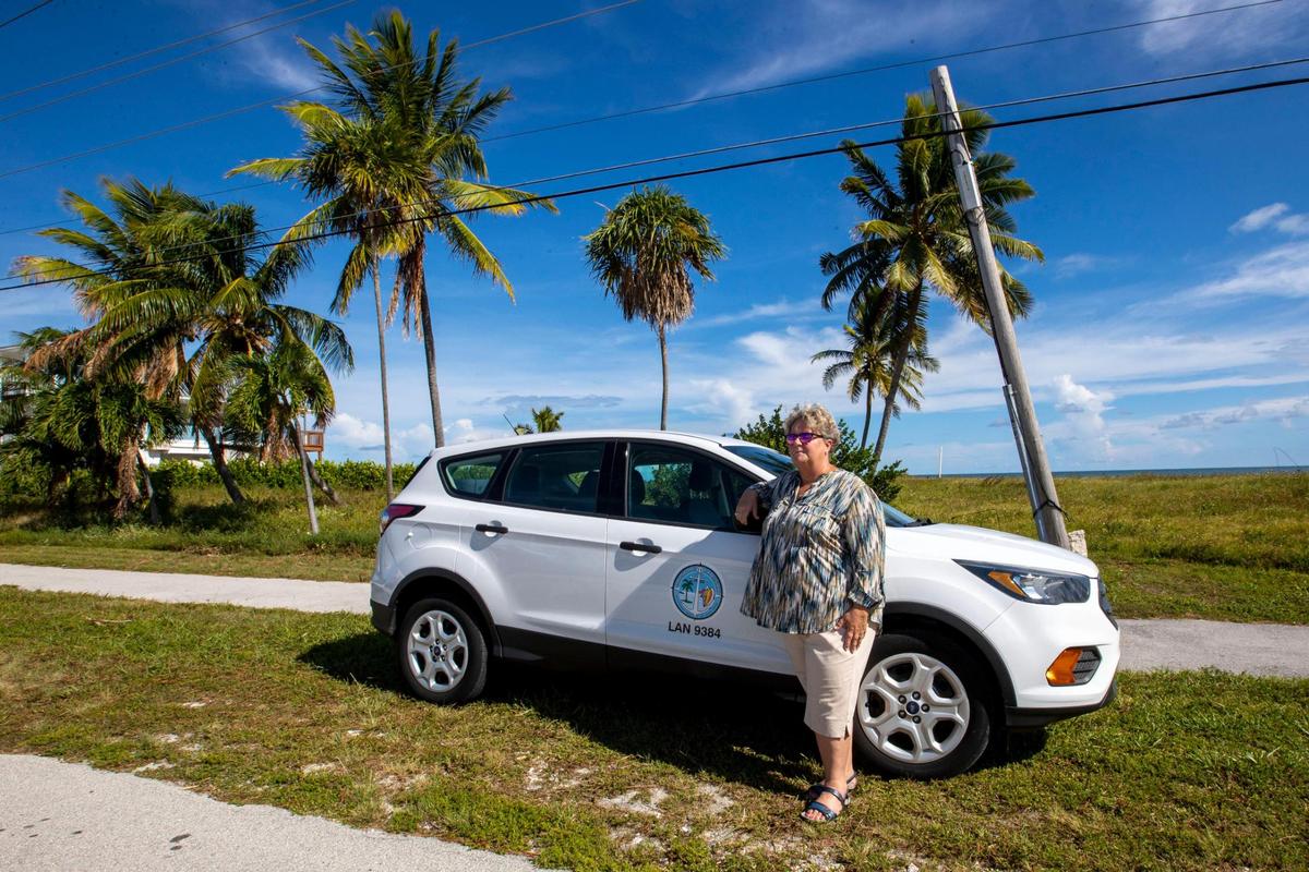 Christine Hurley, executive director of the Monroe County Land Authority, stands near a lot recently bought by the Community Development Block Grant-Disaster Recovery funds for the Monroe County Voluntary Home Buyout Program at Long Pine Key in Layton, Florida, on Wednesday, Aug. 24, 2022.