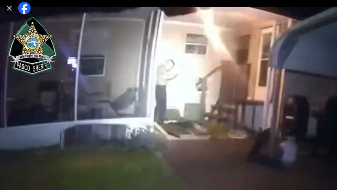 This body camera image shows the suspect was found standing with hands raised after the shots were fired around 8:30 p.m. on Thanksgiving.