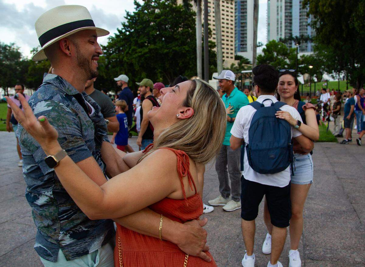 Alexander Brigantty (left) and Xiomara Zayas (right) laugh and dance during the Fourth of July Bayfront Park Celebration at Bayfront Park on Tuesday, July 4, 2023 in Miami, Fla.