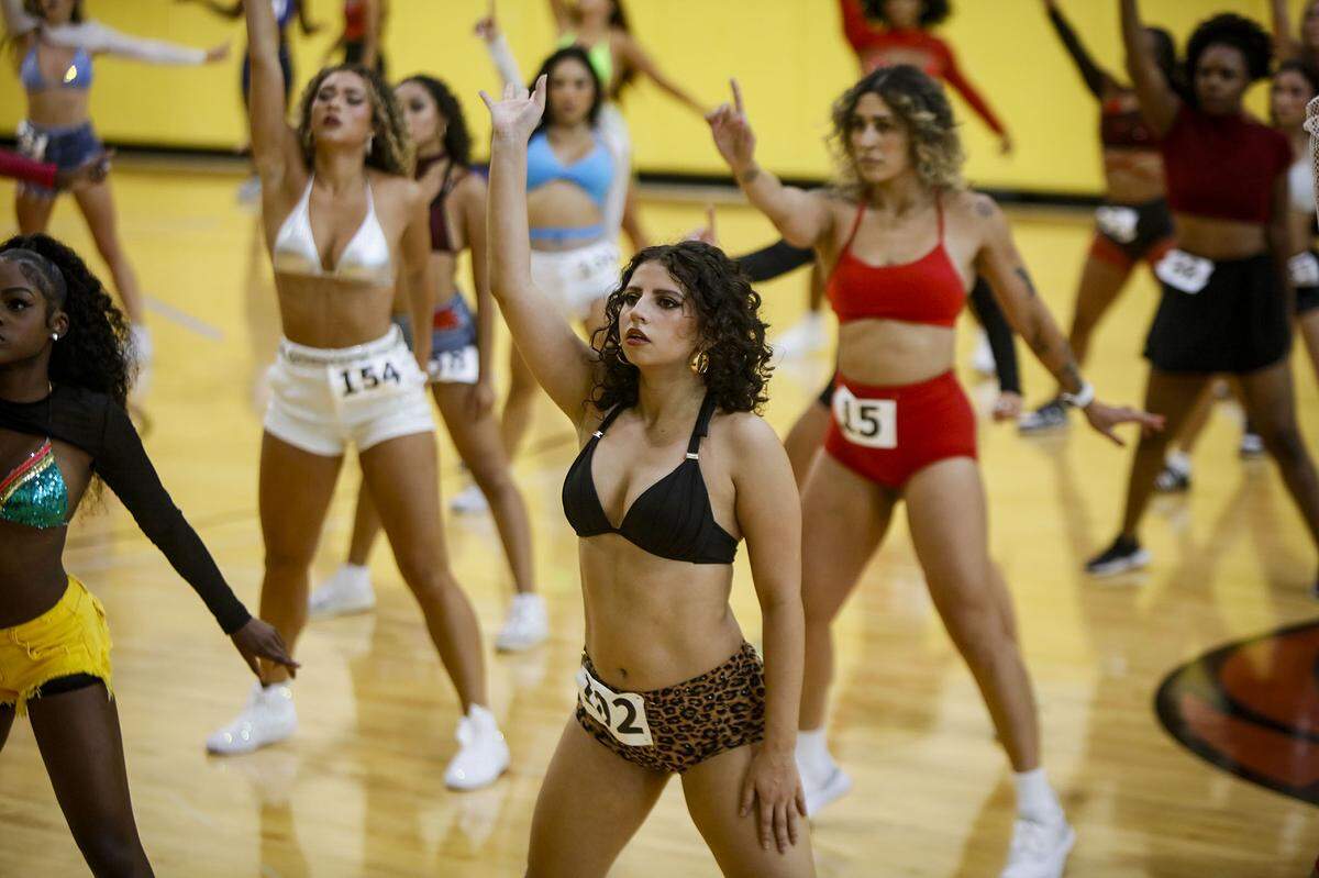 Contestants perform during auditions for a spot on next season's Heat dancers team.