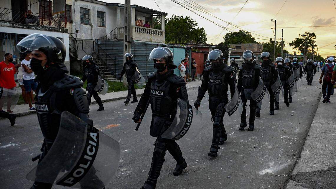 Riot police walk the streets after a demonstration against the government of President Miguel Diaz-Canel in Arroyo Naranjo Municipality, Havana on July 12, 2021.