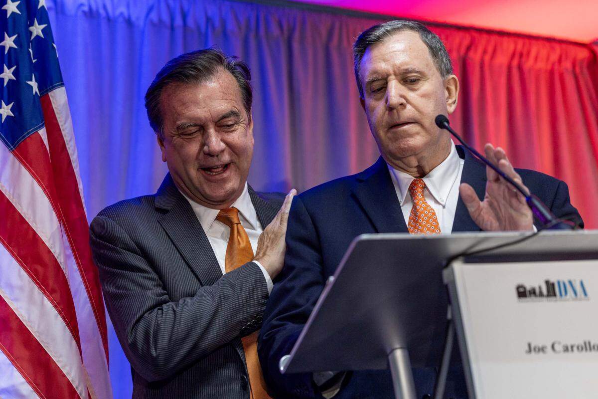 Former Commissioner Alex Díaz de la Portilla interacts with Miami Commissioner Joe Carollo during a City of Miami mayoral debate hosted by the Downtown Neighbors Alliance at Hyatt Regency Miami on Tuesday, September 30, 2025, in Miami, Fla. Other candidates in attendance included former Commissioner Ken Russell, Miami-Dade Commissioner Eileen Higgins, former Mayor Xavier Suarez and former City Manager Emilio T. Gonzalez.