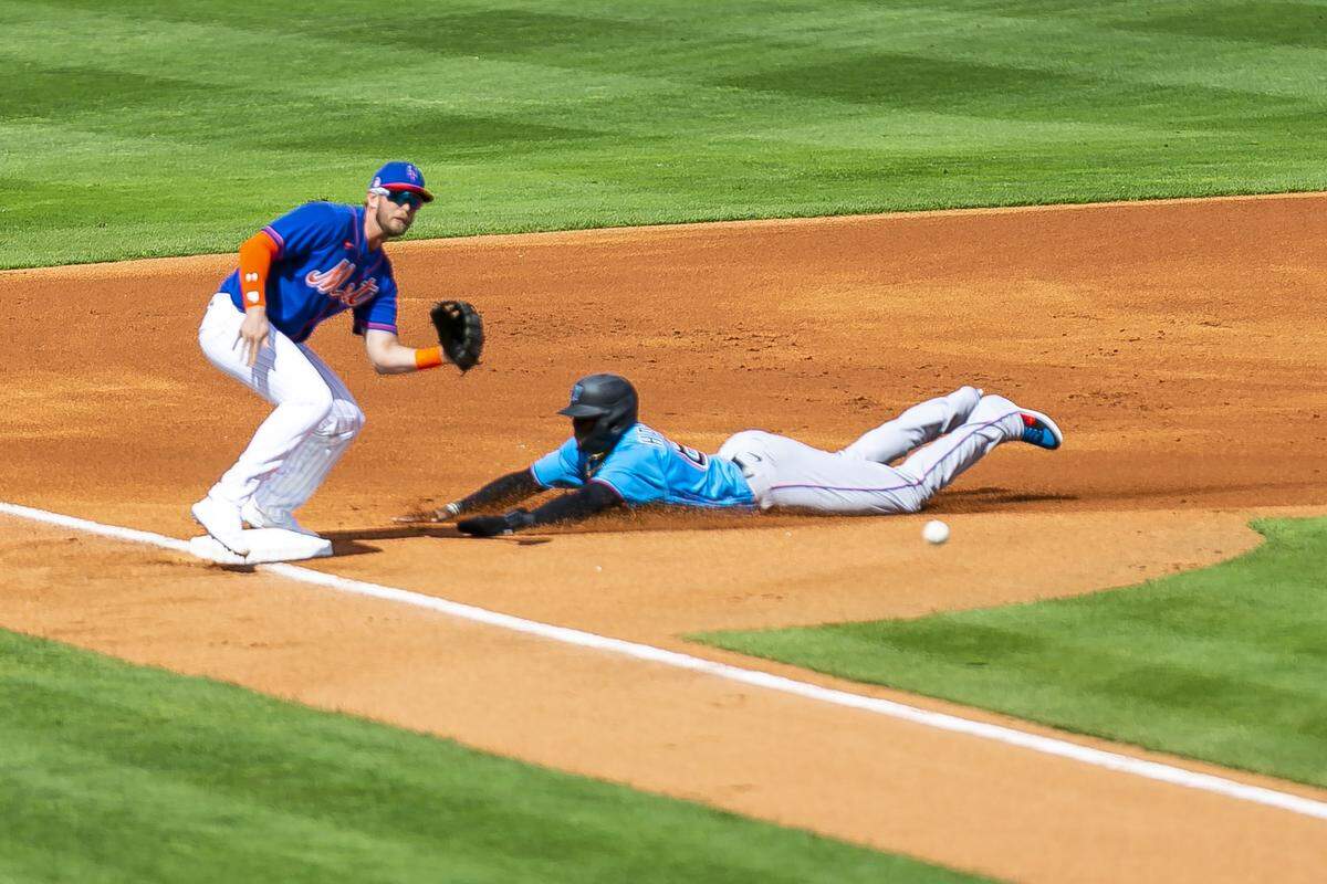 Miami Marlins center fielder Monte Harrison (63) steals third base in the first inning against the New York Mets during a spring training MLB game at Clover Park in Port St. Lucie, Florida on Saturday, February 22, 2020.