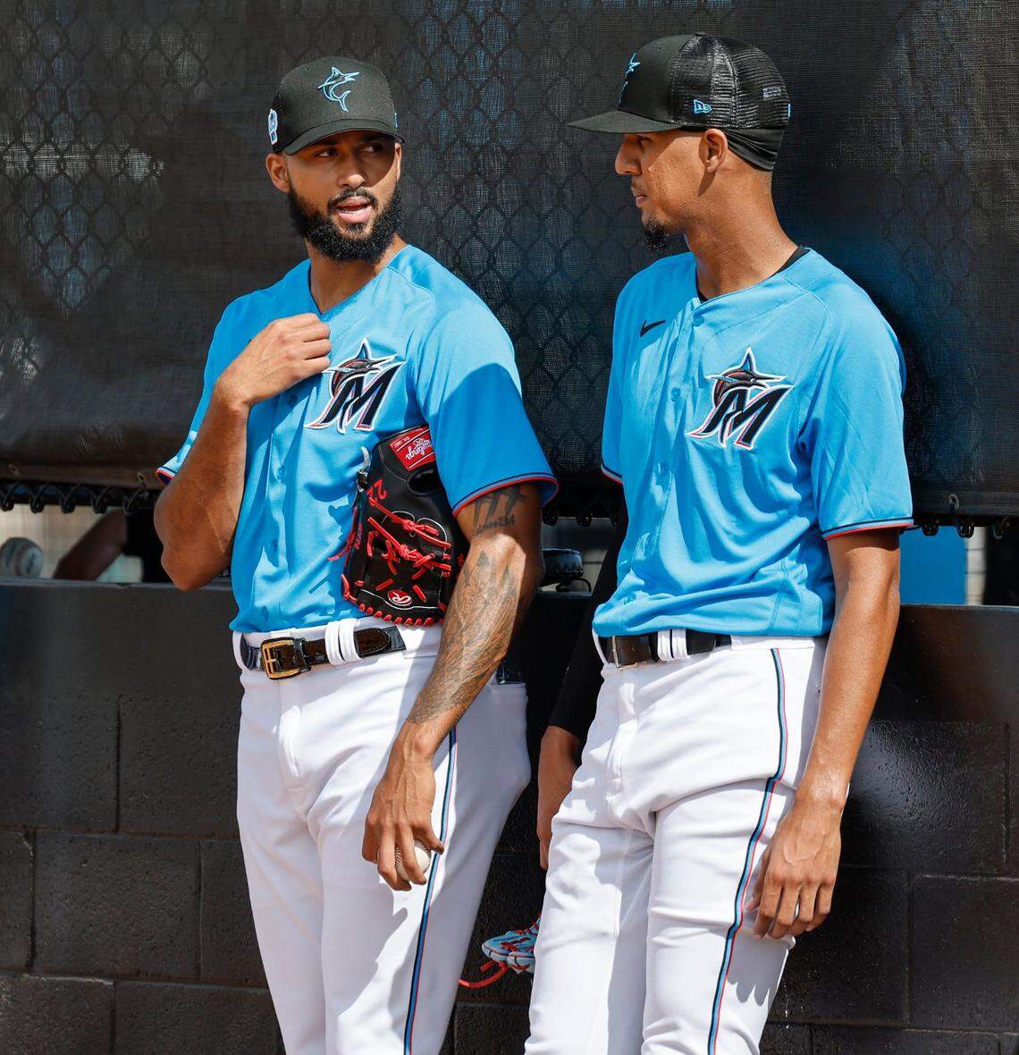 Miami Marlins pitchers Sandy Alcantara (left) and Eury Perez talk after a bullpen session at Roger Dean Chevrolet Stadium in Jupiter, Florida on Thursday, February 16, 2023.