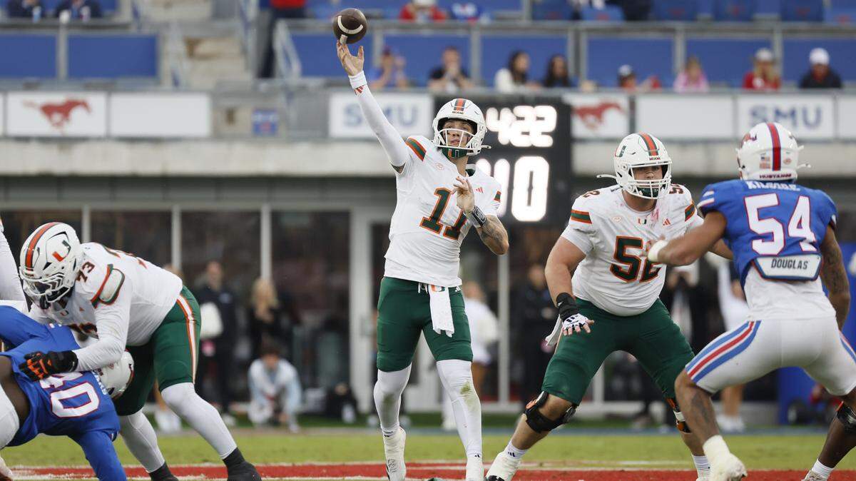 Miami Hurricanes quarterback Carson Beck (11) throws a touchdown pass during an NCAA football game against the Southern Methodist University Mustangs in the first half at Gerald Ford Stadium on Saturday, November 1, 2025, in Dallas, Texas.