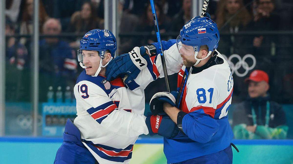 MILAN, ITALY - FEBRUARY 20: Matthew Tkachuk #19 of Team United States and Erik Cernak #81 of Team Slovakia get into an altercation in the third period during the Men's Semifinals Playoff match between the United States and Slovakia on day fourteen of the Milano Cortina 2026 Winter Olympic games at Milano Santagiulia Ice Hockey Arena on February 20, 2026 in Milan, Italy. (Photo by Elsa/Getty Images)