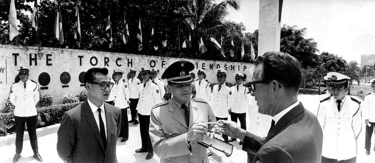 In 1964, Miami City Commissioner Steve Clark, right, presents a city key to Capt. Jorge Cardenes Ramirez, leader of a visiting group of Peruvian Cadets.