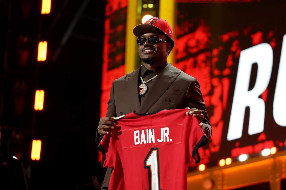 PITTSBURGH, PENNSYLVANIA - APRIL 23: Rueben Bain Jr. of Miami celebrates after being selected fifteenth overall pick by the Tampa Bay Buccaneers during Round One of the 2026 NFL Draft at Acrisure Stadium on April 23, 2026 in Pittsburgh, Pennsylvania. (Photo by Emilee Chinn/Getty Images)