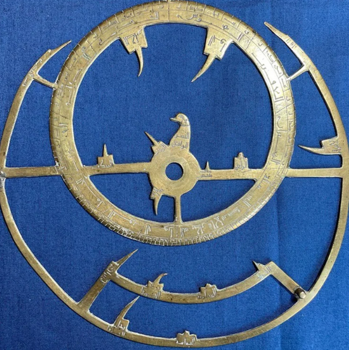 The astrolabe’s rete includes star pointers and a bird-shaped carving.