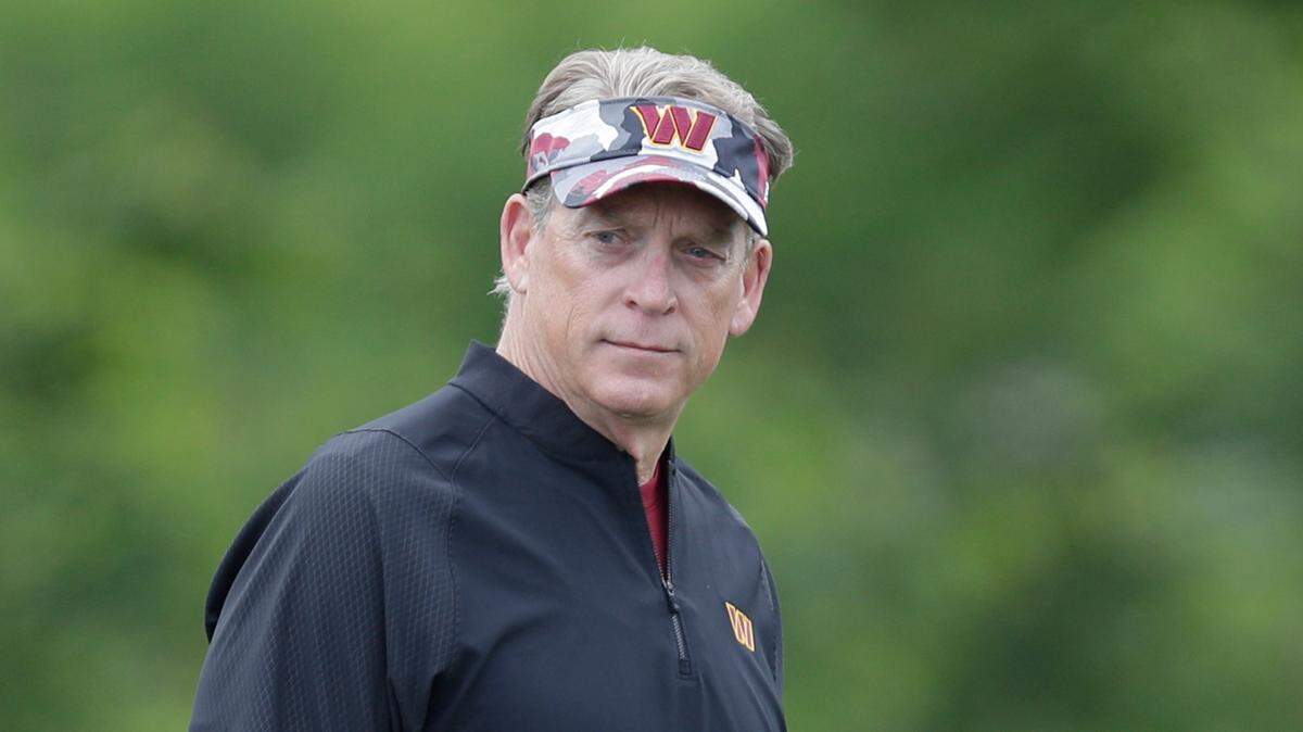 Washington Commanders defensive coordinator Jack Del Rio talks to defensive tackle Jonathan Allen during an NFL football practice at Inova Sports Performance Center in Ashburn, Va., Wednesday, June 8, 2022.