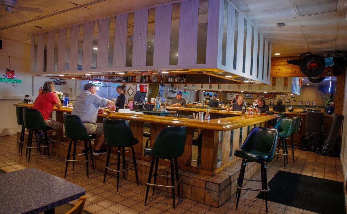 Customers in the lounge of the Peter Pan Diner in Oakland Park. Owner Jeronimos Kourkoumelis plans to remodel the room.