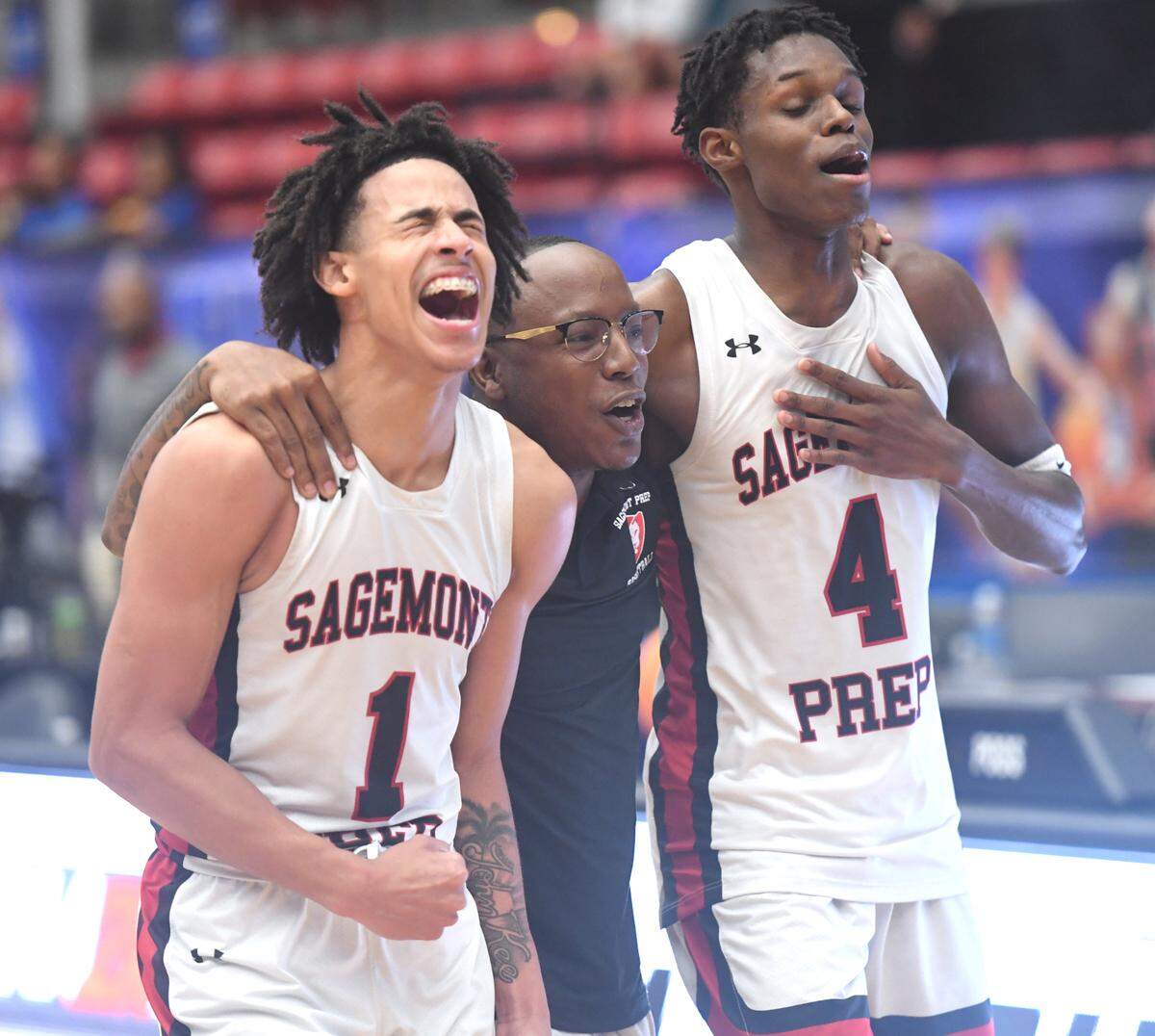 Sagemont’s Jordyn Kee (1) and Kevin Thomas (4) celebrate their victory over Orlando Christian Prep in the Class 2A final during the Florida High School State Championships at the RP Funding Center in Lakeland, Fl on Thursday February 29, 2024. Sagemont defeated Orlando Christian Prep 50-47. Thomas was the game-high scorer with 19 and Kee was second highest with 16. Scott Wheeler | Photo