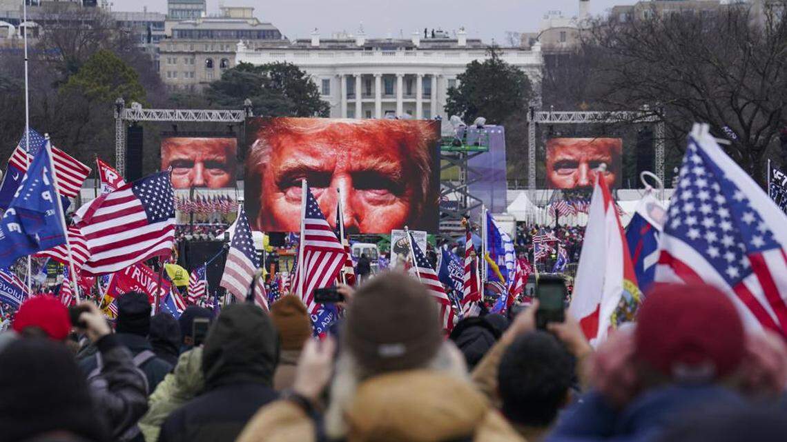 President Trump appears on large screens as supporters participate in a rally in Washington, D.C., on Jan. 6 2021, just before the violent insurrection at the U.S. Capitol.
