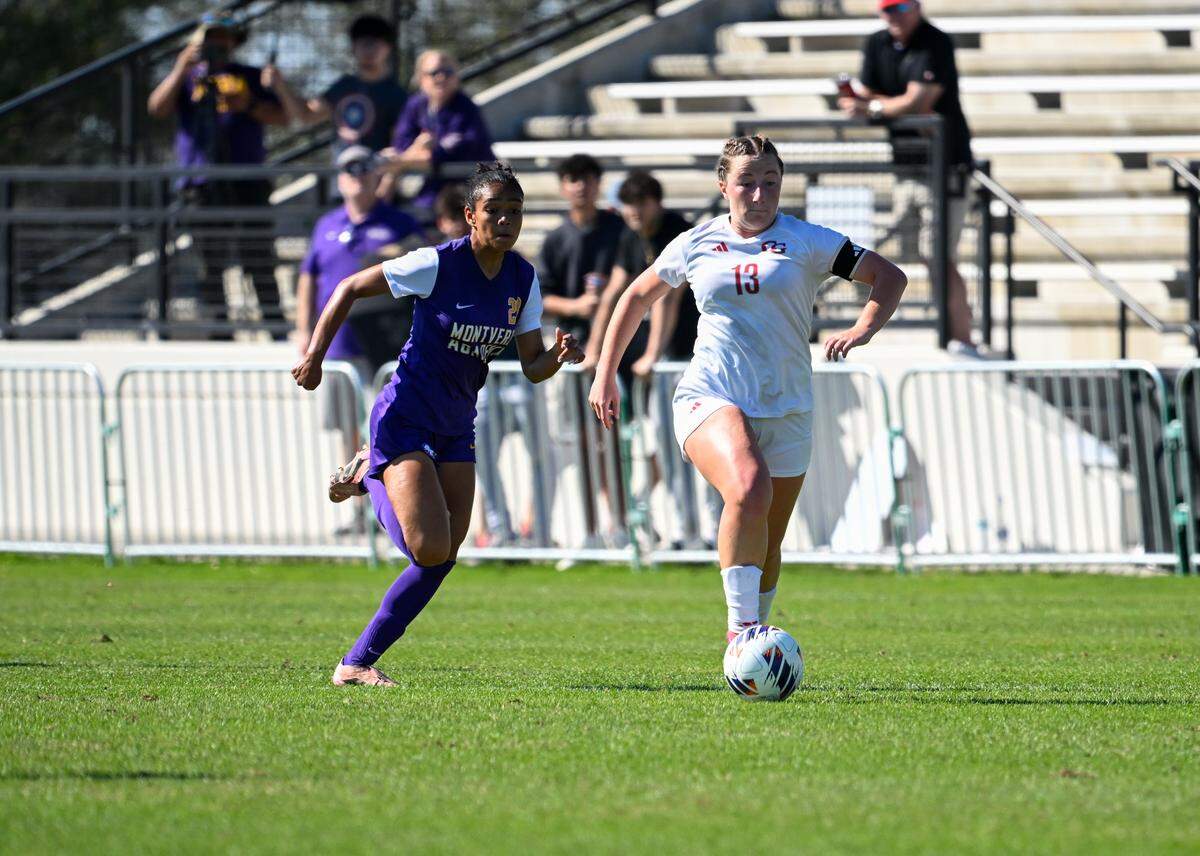 Cardinal Gibbons’ Caroline Findley (13) drives up field against Montverde Academy during Saturday’s Class 3A girls’ soccer state championship game at Lake Myrtle Sports Complex in Auburndale, Fla.