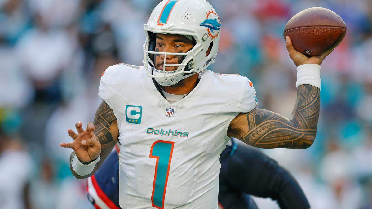 Miami Dolphins quarterback Tua Tagovailoa (1) sets up to pass against the New England Patriots in the second half of their NFL football game at Hard Rock Stadium in Miami Gardens, Florida, on Sunday, November 24, 2024. 