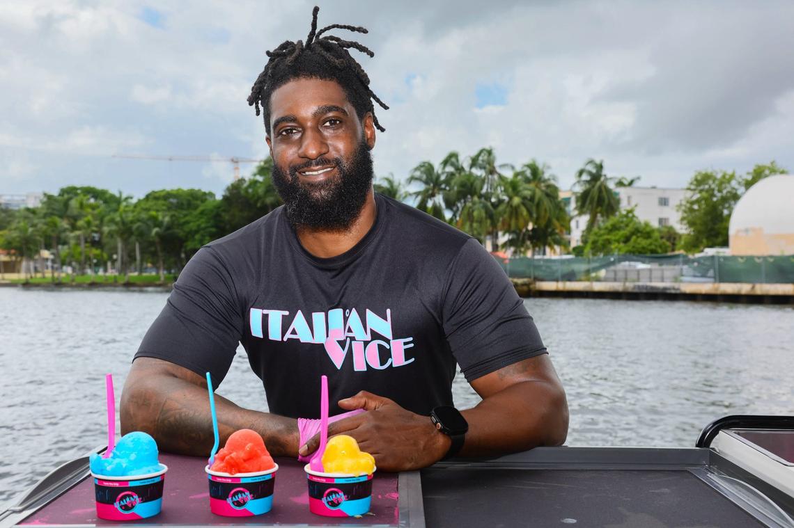 Aamir Taylor, owner of Italian Vice, a Miami-based water ice company, is photographed with a cup of water ice flavors Nipsey Blue, Saweetie Strawberry, and Mango Meek, by the Miami River in downtown Miami, Friday, October 11, 2024. Taylor named the flavors after hip-hop artists.