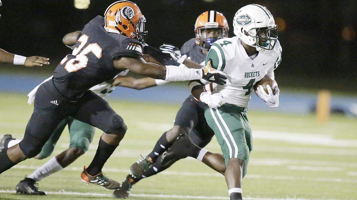 Miami Central Rockets’ running back Lexington Joseph (4) escapes a tackle by Carol City Chiefs during the Region 4-6A semifinal Nov. 16, 2018, at Traz Powell Stadium. Joseph ran for 1,658 yards and 16 touchdowns this past season, making first-team All-Dade.