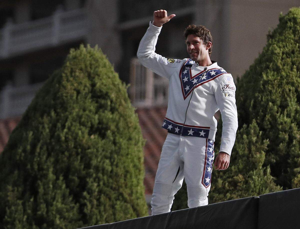 Travis Pastrana celebrates after jumping the fountain at Caesars Palace on a motorcycle Sunday, July 8, 2018, in Las Vegas. Pastrana recreated three of Evel Knievel’s iconic motorcycle jumps on Sunday, including the leap over the fountains of Caesars Palace that left Knievel with multiple fractures and a severe concussion.