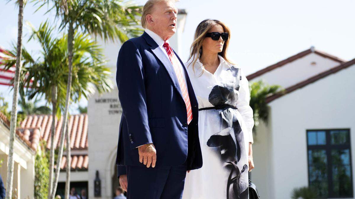 Donald and Melania Trump stand in front of members of the media after casting votes earlier this year.