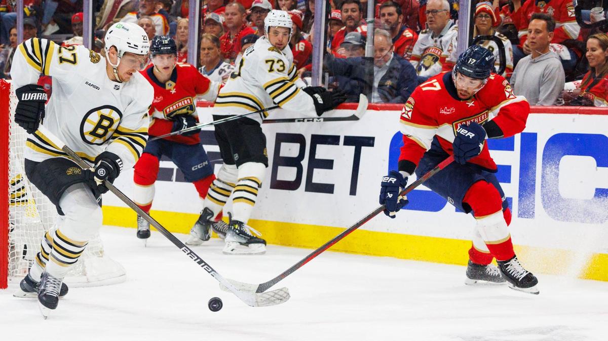 Florida Panthers center Evan Rodrigues (17) and Boston Bruins defenseman Hampus Lindholm (27) go after the puck during the first period of Game 5 of a second-round Stanley Cup Playoff series on Tuesday, May 14, 2024, at Amerant Bank Arena in Sunrise, Fla.
