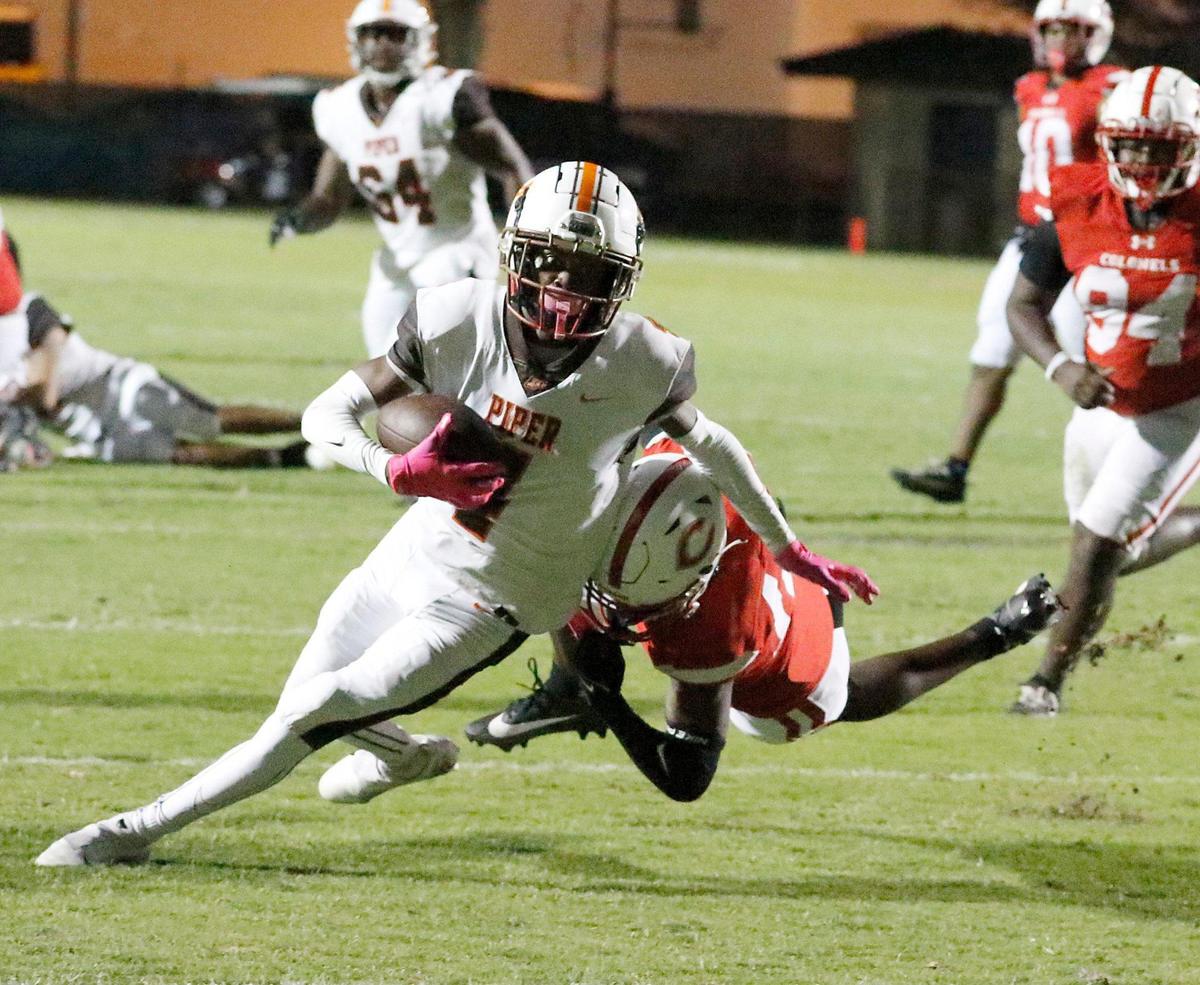 Bengals wide receiver Jamir Woodard (4) escapes a tackle during the football game against Plantation Colonels on Friday, October 27, 2023 at PAL Stadium in Fort Lauderdale. Andrew Uloza / for Miami Herald