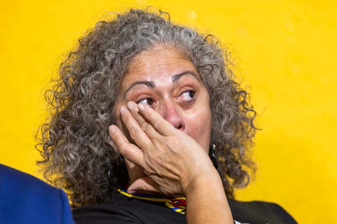 Mayra Marchan, a representative of the group All For Venezuela, wipes away tears during a press conference held by the Venezuelan American Caucus at El Arepazo restaurant on Feb. 3, 2025, in Doral.
