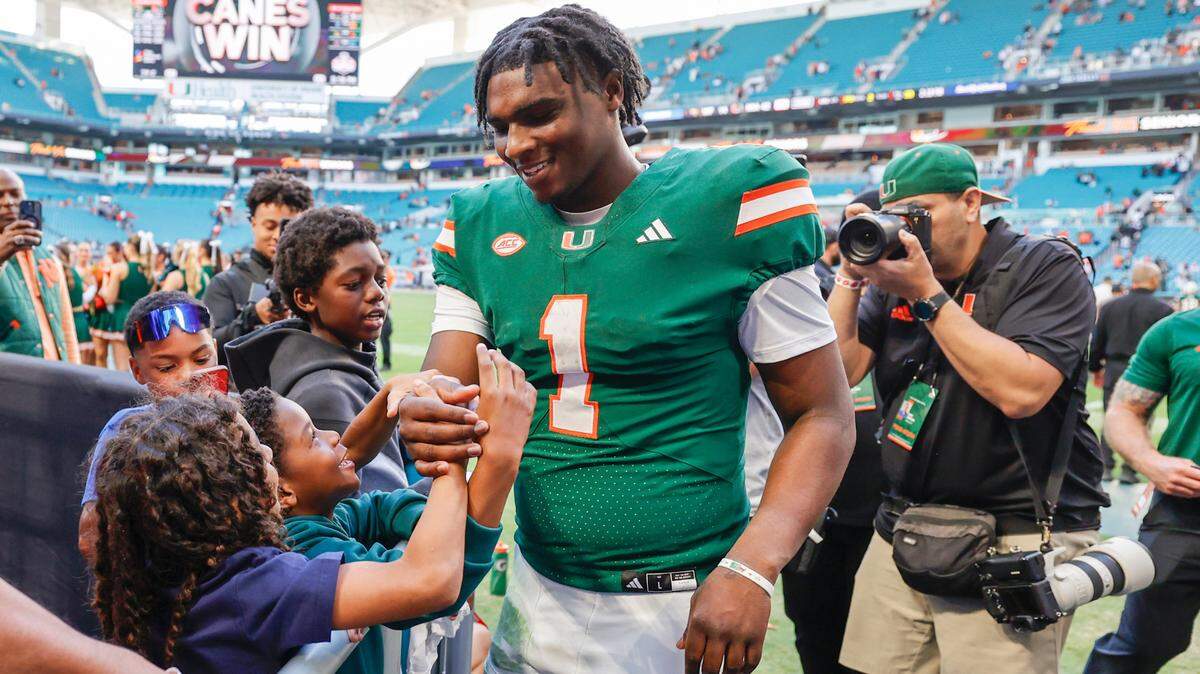 Cam Ward meets with fans after the Miami Hurricanes’ win over the Wake Forest Demon Deacons in Miami Gardens, Florida, on Saturday, November 23, 2024.