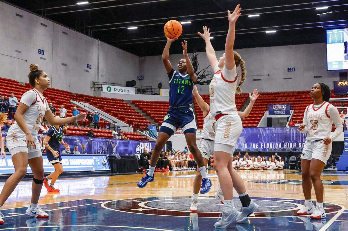SLAM Miami Titans Jim’Miyah Branton (12) attempts a basket against Cardinal Mooney in the second half during girls 3A basketball semifinal game of the Florida High School State Championships at the RP Funding Center in Lakeland, Florida on Friday, February 28, 2025.