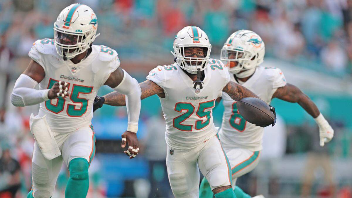 Miami Dolphins cornerback Xavien Howard (25) runs back an interception in the second quarter during the game against the Carolina Panthers at Hard Rock Stadium on Sunday, Nov. 28, 2021.